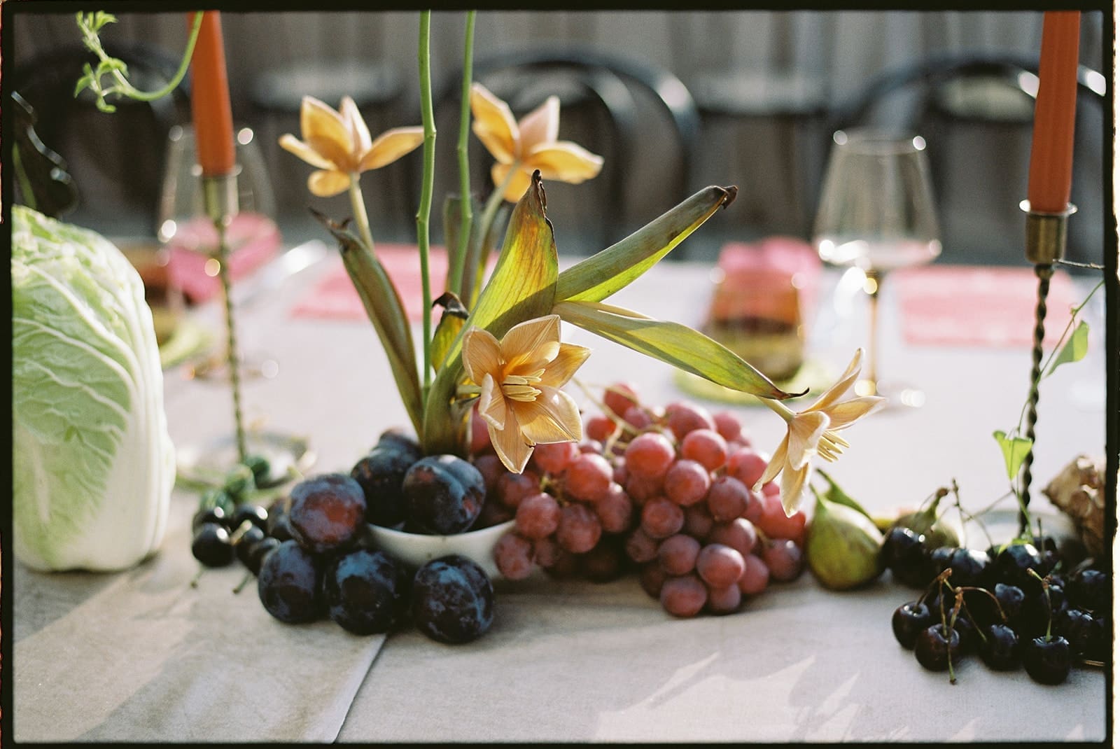 35mm film photo of flowers and fruit for a wedding table design